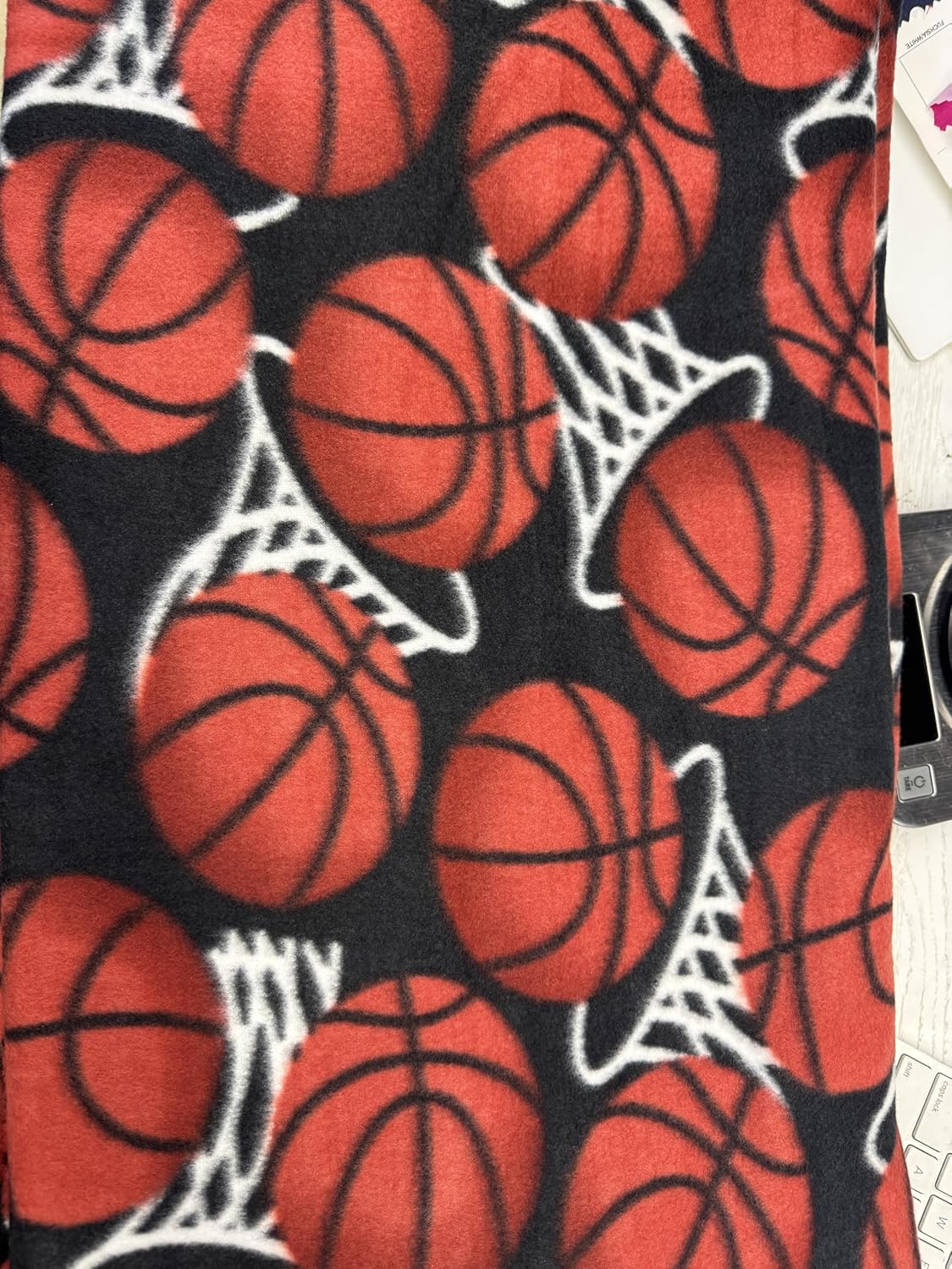 ADFabric, Blizzard or Anti-Pill Fleece with a Printed Pattern of red basketballs and White Hoops or nets on a Black Background, 58" Wide, Sold by Yard. (3 Yard pre Cut) - Image 2