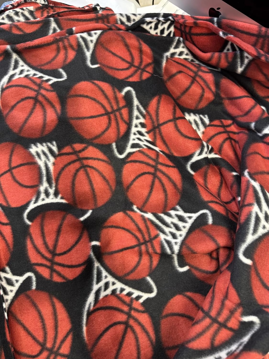 ADFabric, Blizzard or Anti-Pill Fleece with a Printed Pattern of red basketballs and White Hoops or nets on a Black Background, 58" Wide, Sold by Yard. (3 Yard pre Cut)