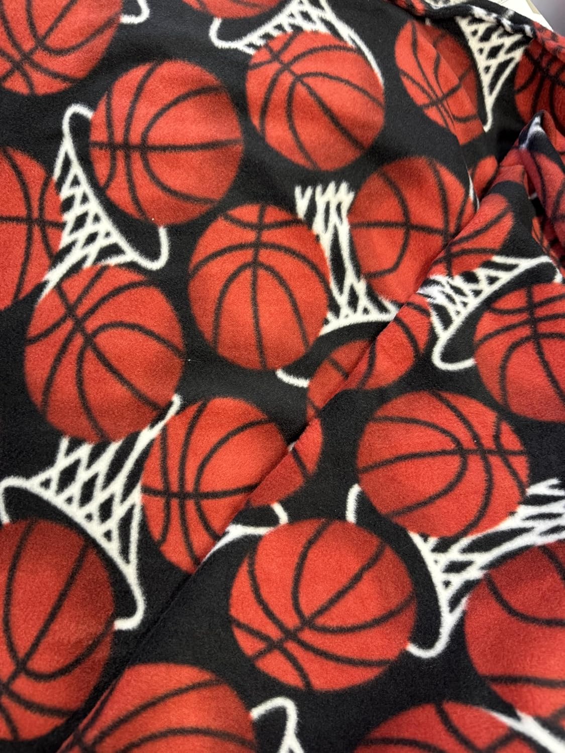 ADFabric, Blizzard or Anti-Pill Fleece with a Printed Pattern of red basketballs and White Hoops or nets on a Black Background, 58" Wide, Sold by Yard. (3 Yard pre Cut) - Image 3